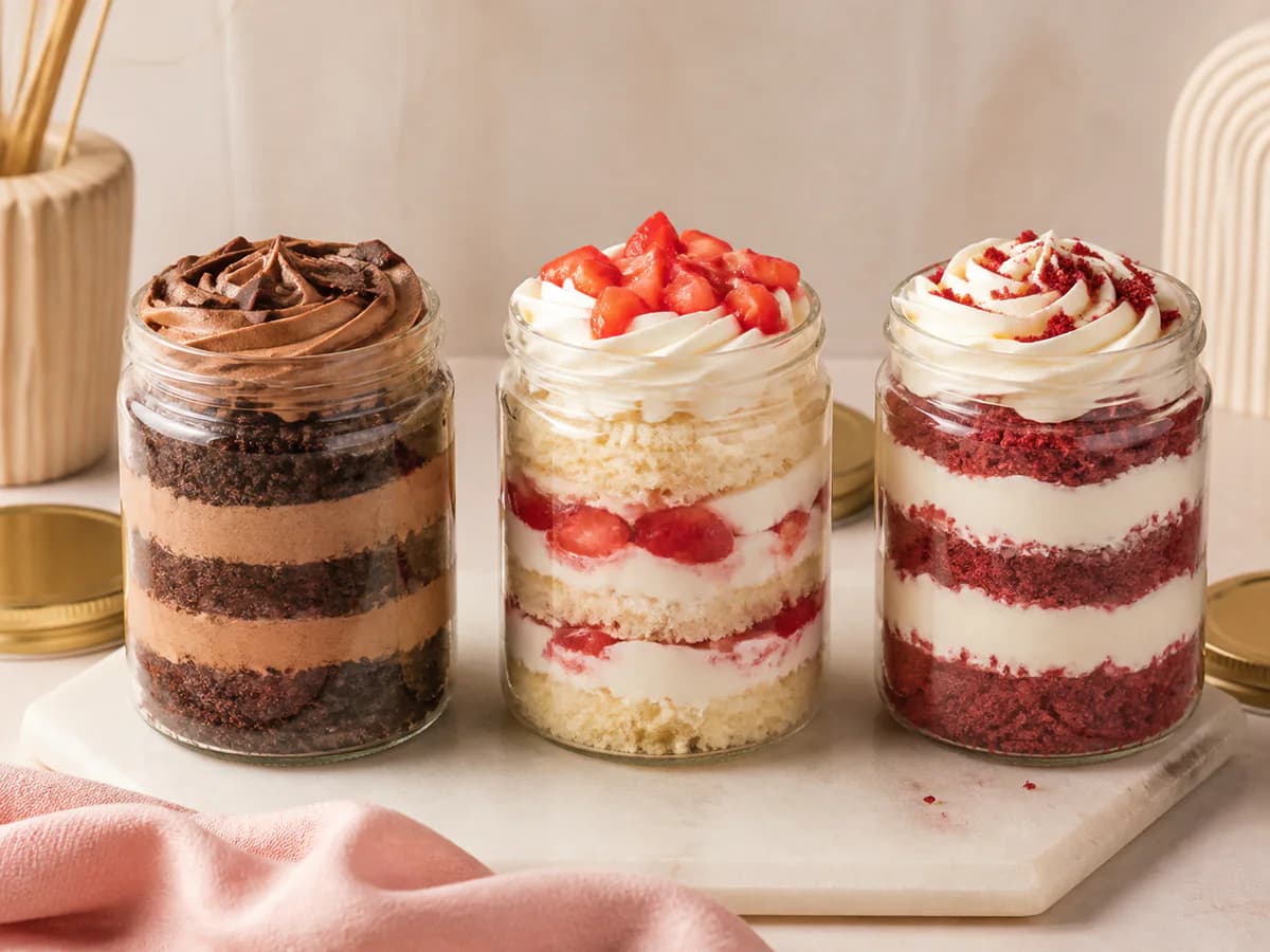 Chocolate, strawberry vanilla, and red velvet layered jar cakes